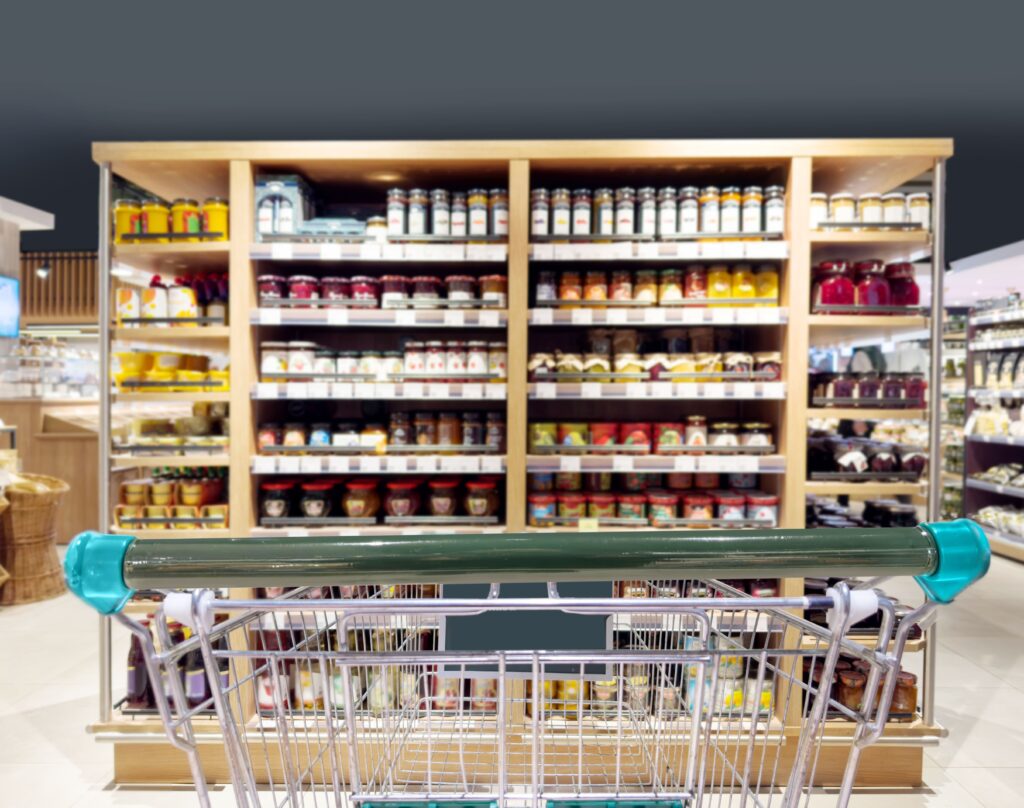 abstract blurred supermarket choosing dairy products supermarketempty grocery cart